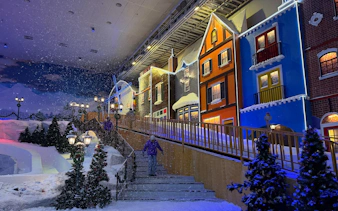 Genting Highlands Snow World Theme Park with colorful buildings and artificial snow.