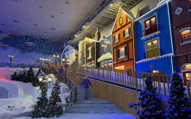 Genting Highlands Snow World Theme Park with colorful buildings and artificial snow.