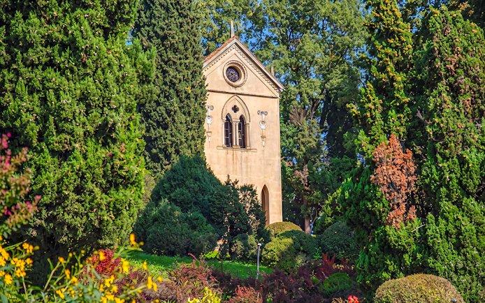 Hermitage of Laura surrounded by lush greenery at Parco Giardino Sigurtà.