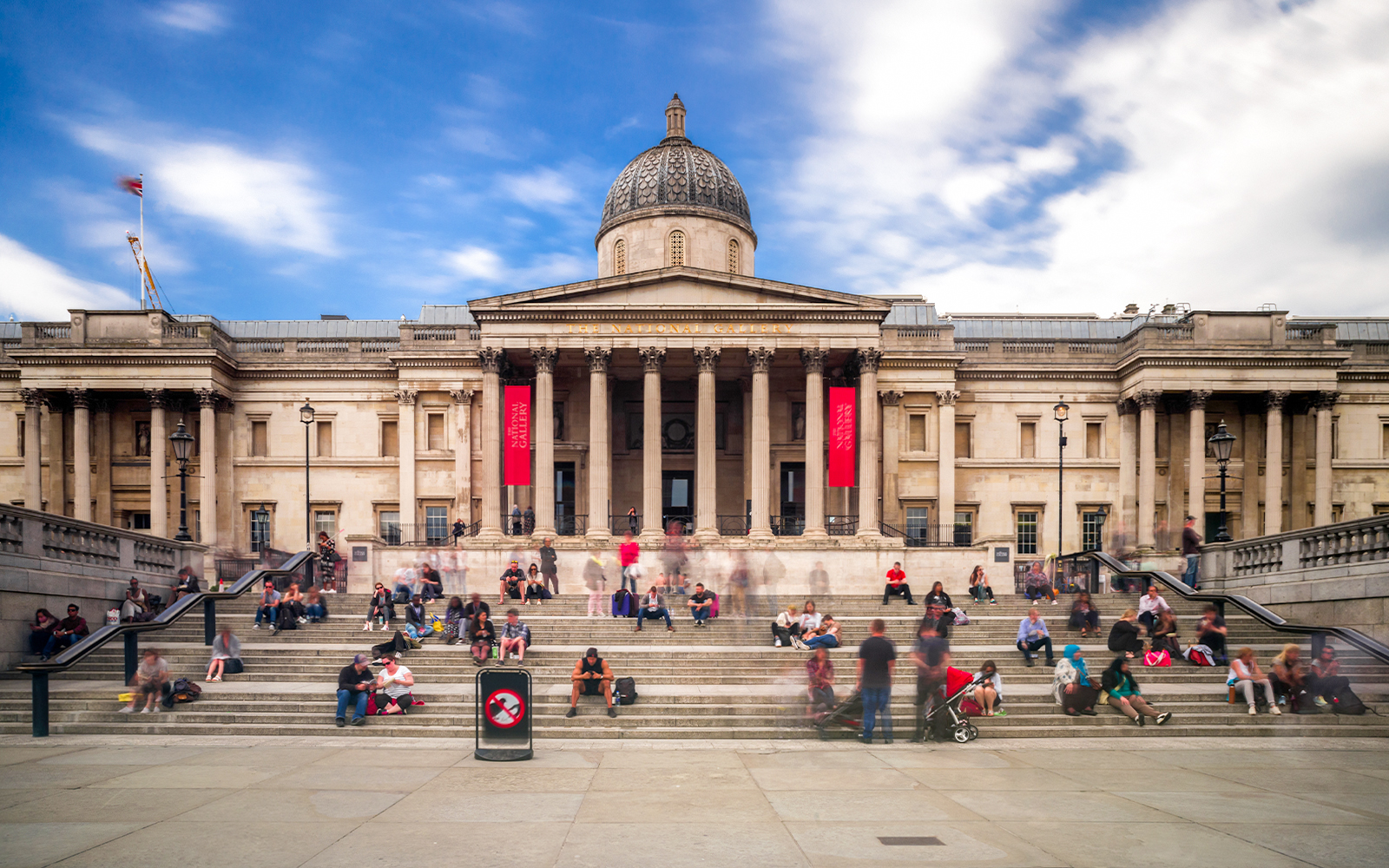 National Gallery in London with visitors on the steps.