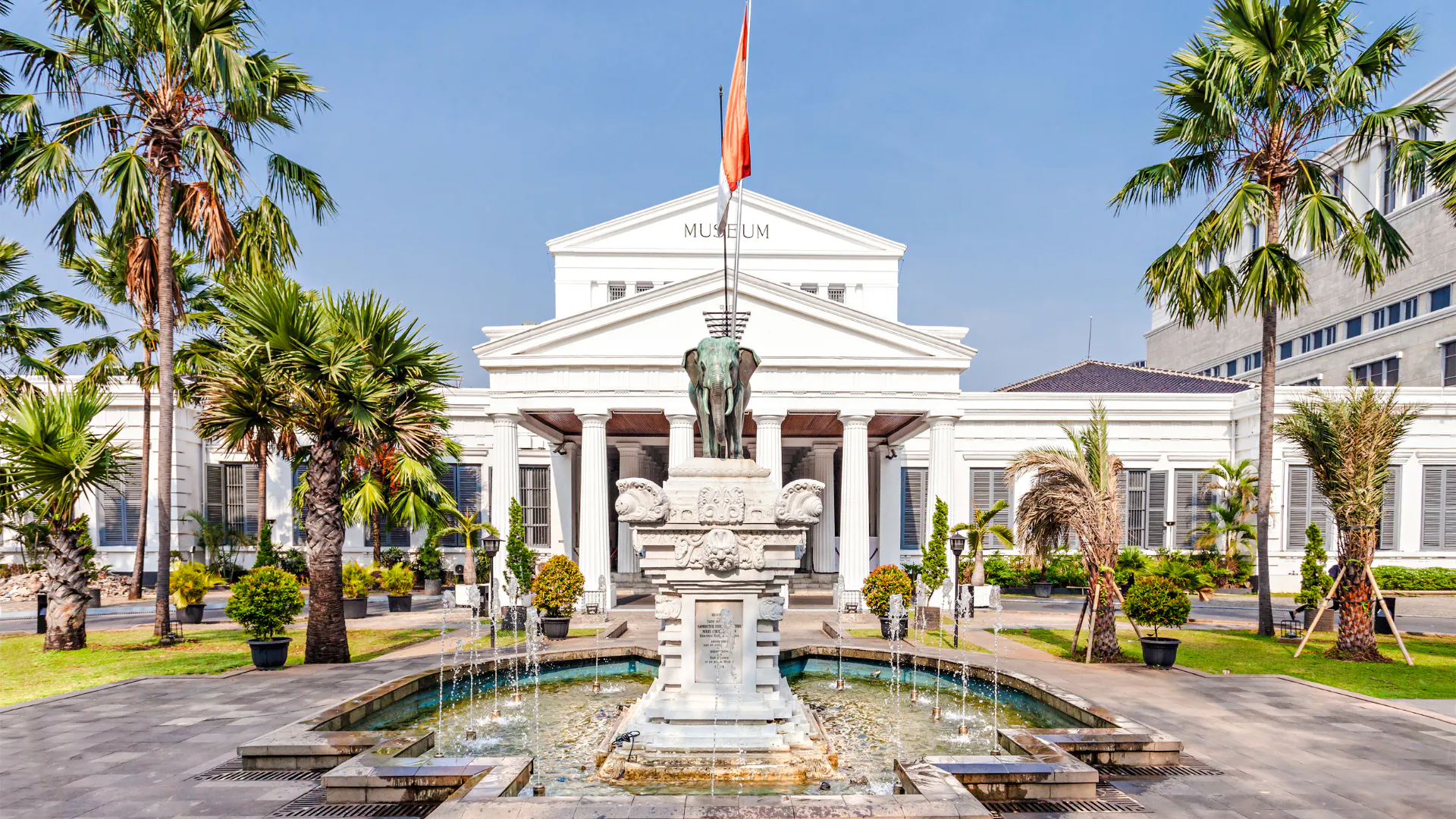 National Museum of Indonesia entrance with elephant statue and fountain, Jakarta.