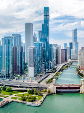 Aerial view of Chicago skyline with skyscrapers and Chicago River.