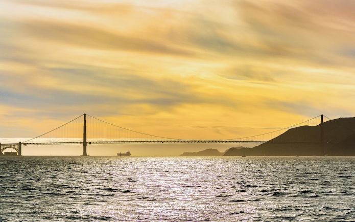 Golden Gate Bridge at sunset viewed from California Sunset Cruise.