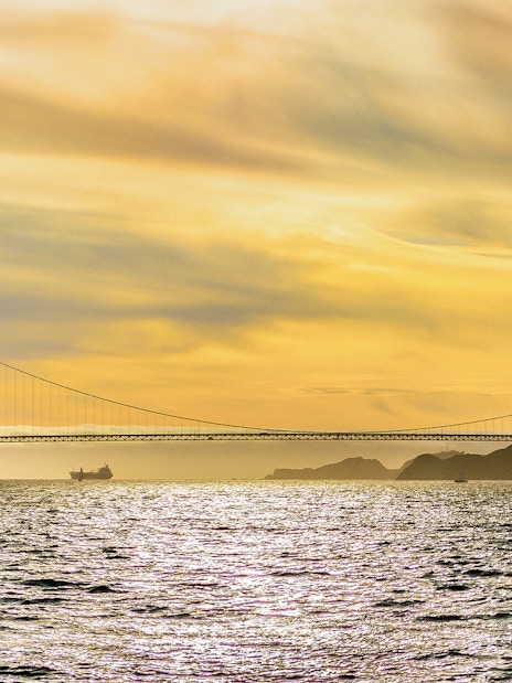 Golden Gate Bridge at sunset viewed from California Sunset Cruise.