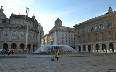 Piazza De Ferrari fountain in Genoa, part of the self-guided city exploration game.