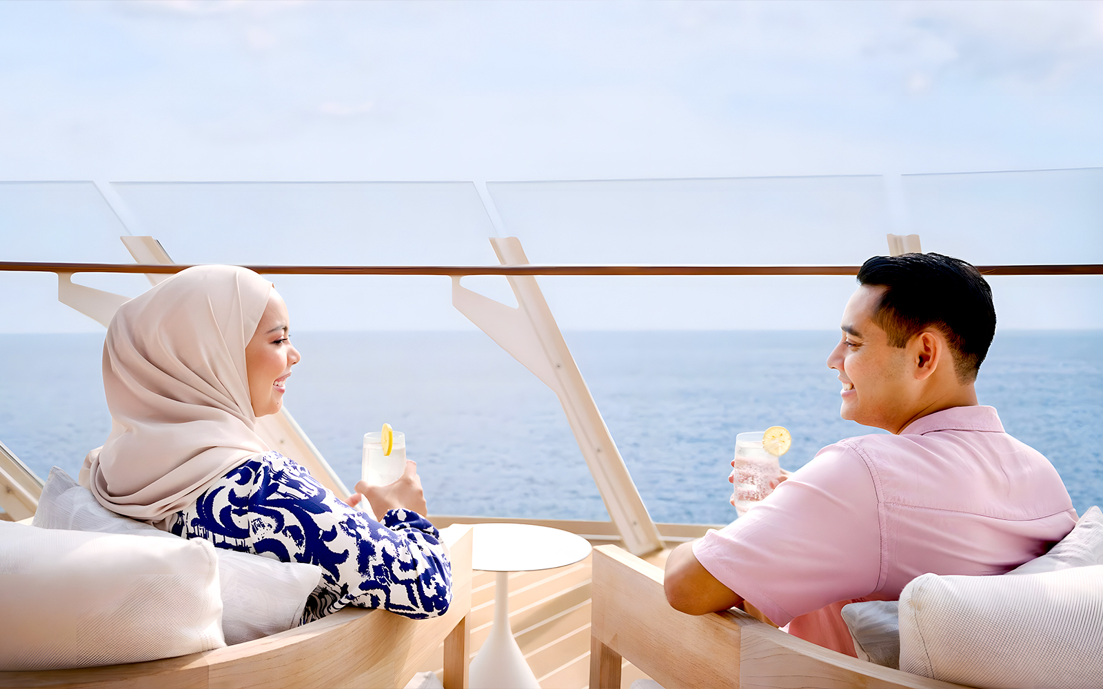 A couple enjoying drinks on Disney Adventure cruise