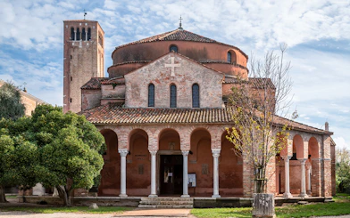 Chiesa di Santa Fosca with arched portico and bell tower, Torcello, Italy.