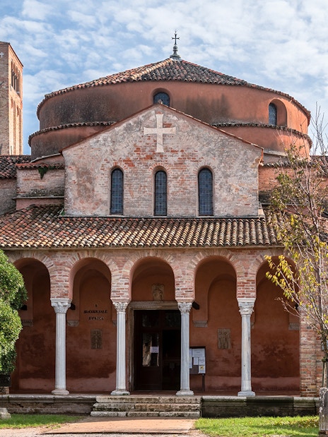Chiesa di Santa Fosca with arched portico and bell tower, Torcello, Italy.