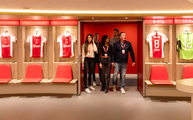 Visitors touring the Johan Cruijff ArenA locker room in Amsterdam.
