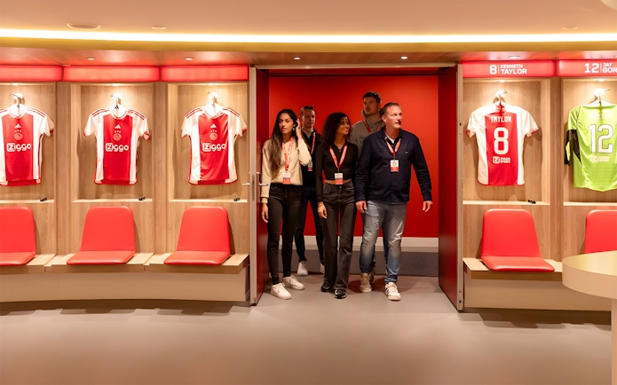 Visitors touring the Johan Cruijff ArenA locker room in Amsterdam.