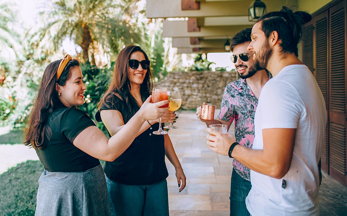 Visitors enjoying wine in Napa-Sonoma Wine Country garden.