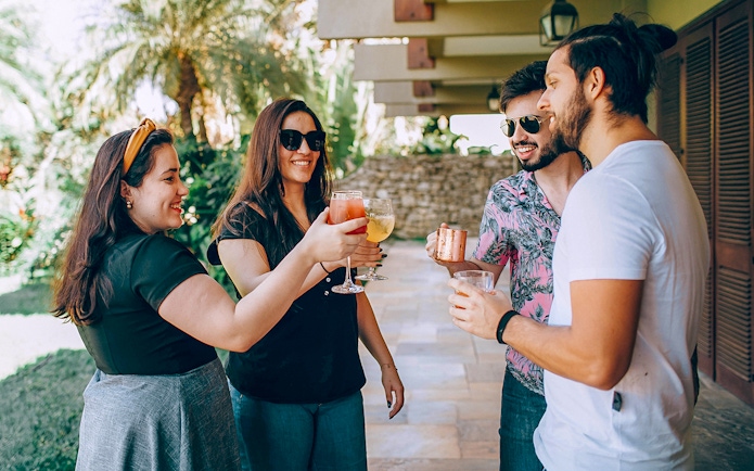 Visitors enjoying wine in Napa-Sonoma Wine Country garden.