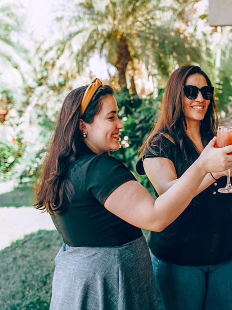 Visitors enjoying wine in Napa-Sonoma Wine Country garden.