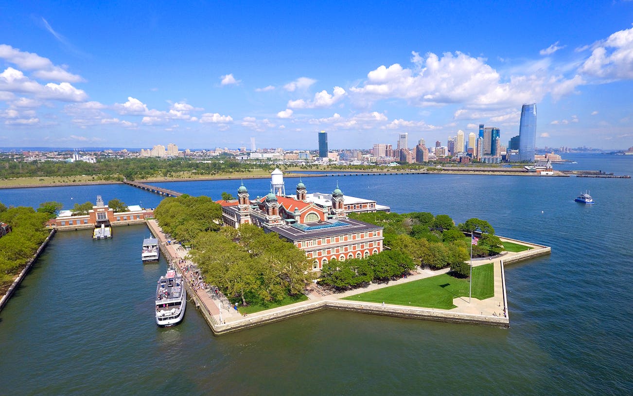 Ellis Island with New York City skyline in the background.