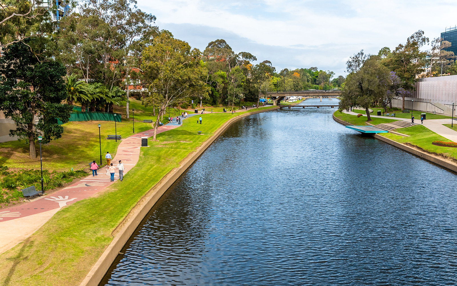 Parramatta Park historic building with lush greenery and walking paths, Sydney, Australia.