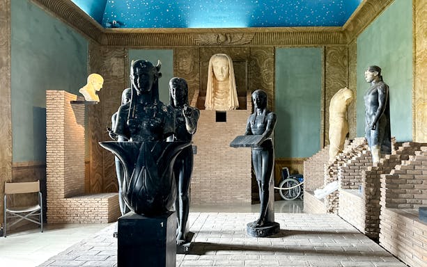 Ancient sculptures in a corridor of the Vatican Museums, part of the Patrizi Palace tour in Rome.