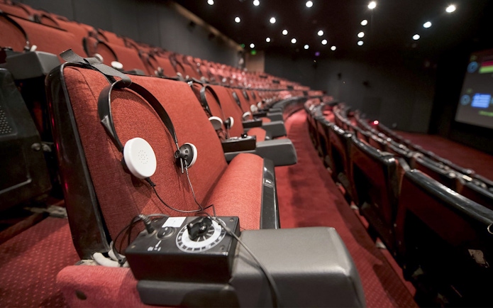 Headphones on theatre seat for The Malta Experience show.