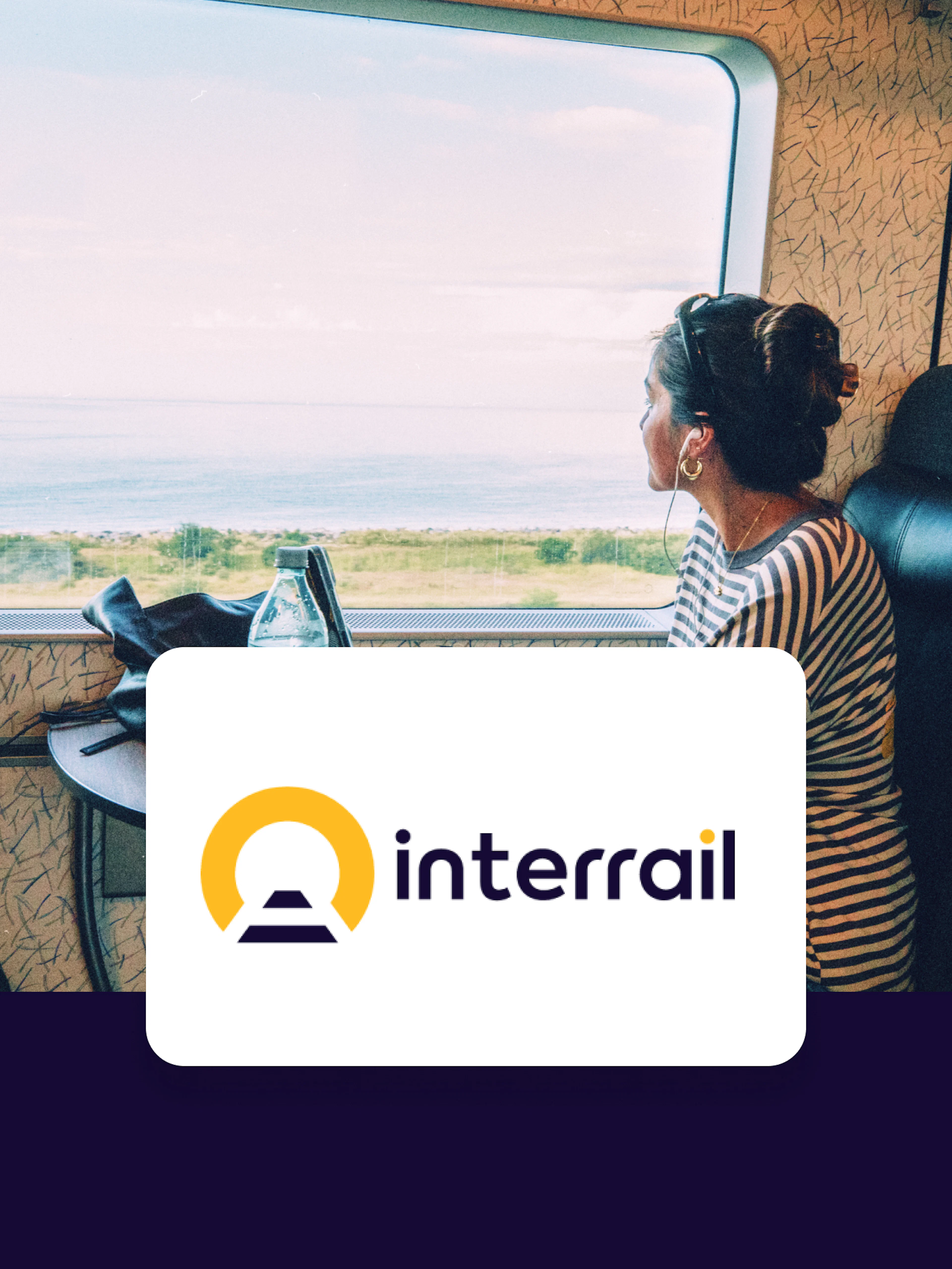Train passenger gazing at coastal view, Interrail Global Continuous Pass.