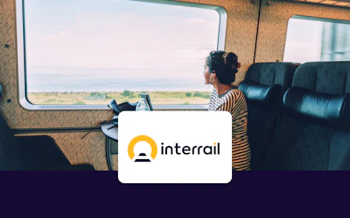 Train passenger gazing at coastal view, Interrail Global Continuous Pass.