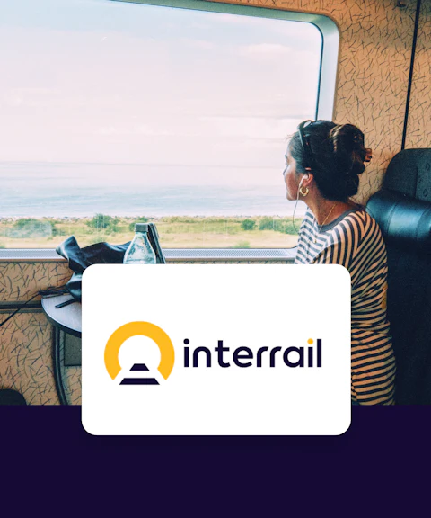 Train passenger gazing at coastal view, Interrail Global Continuous Pass.