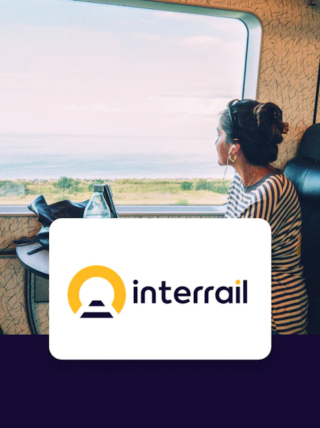 Train passenger gazing at coastal view, Interrail Global Continuous Pass.