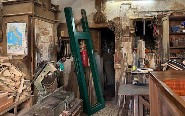 Ancient woodworking tools and materials in an Ortigia craft workshop.