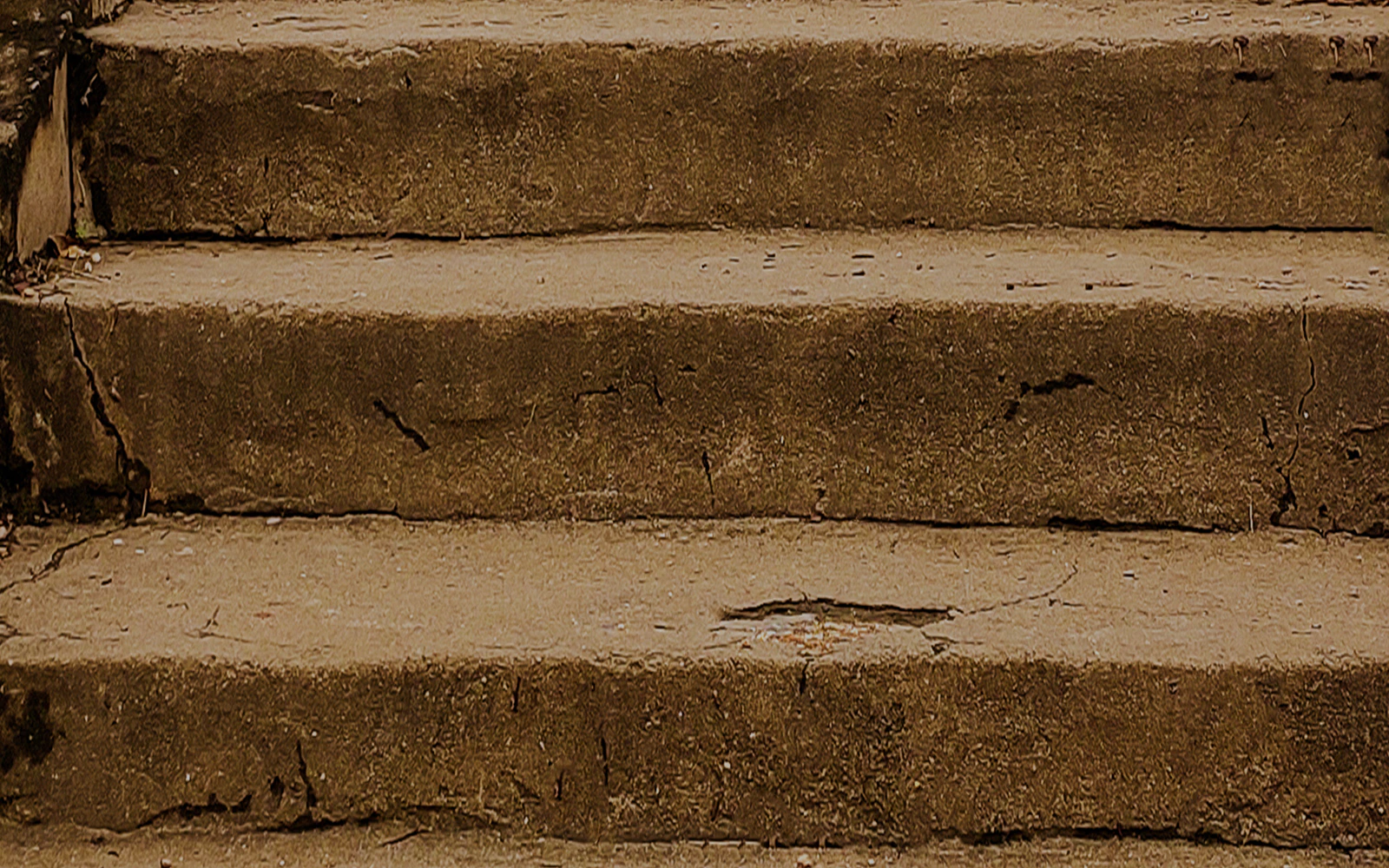 Cracked concrete steps from 9/11 site, symbolizing resilience and history.
