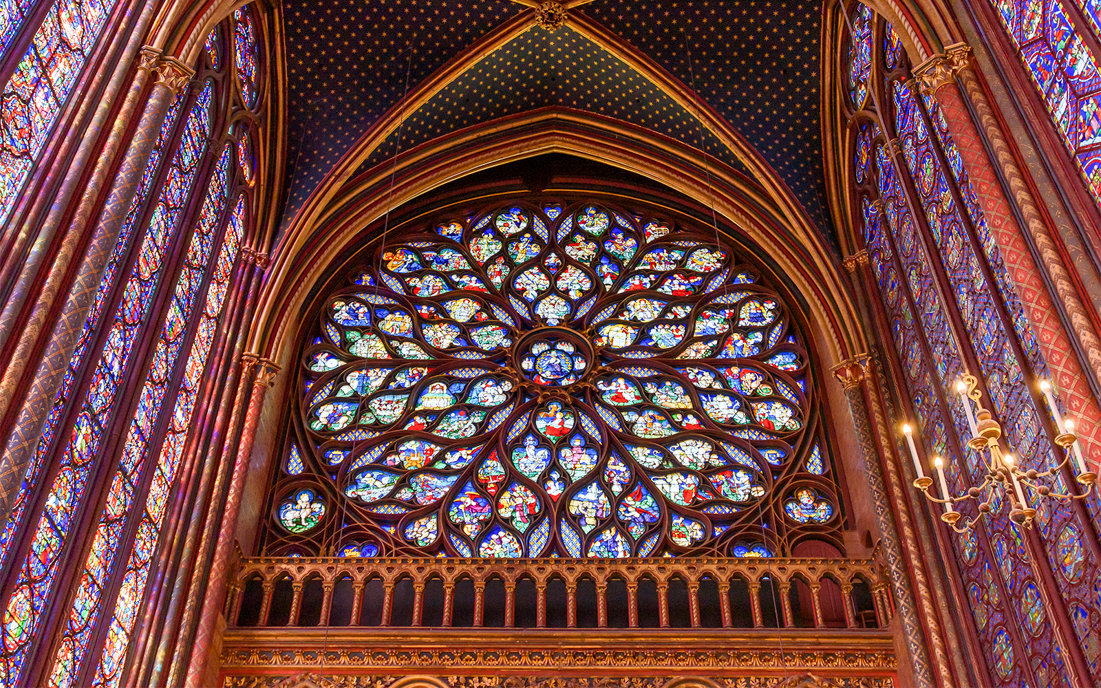 Sainte Chapelle Paris rose window with intricate stained glass design.