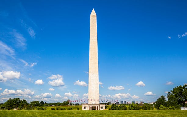 Washington Monument with reflecting pool in Washington DC, view from the east.