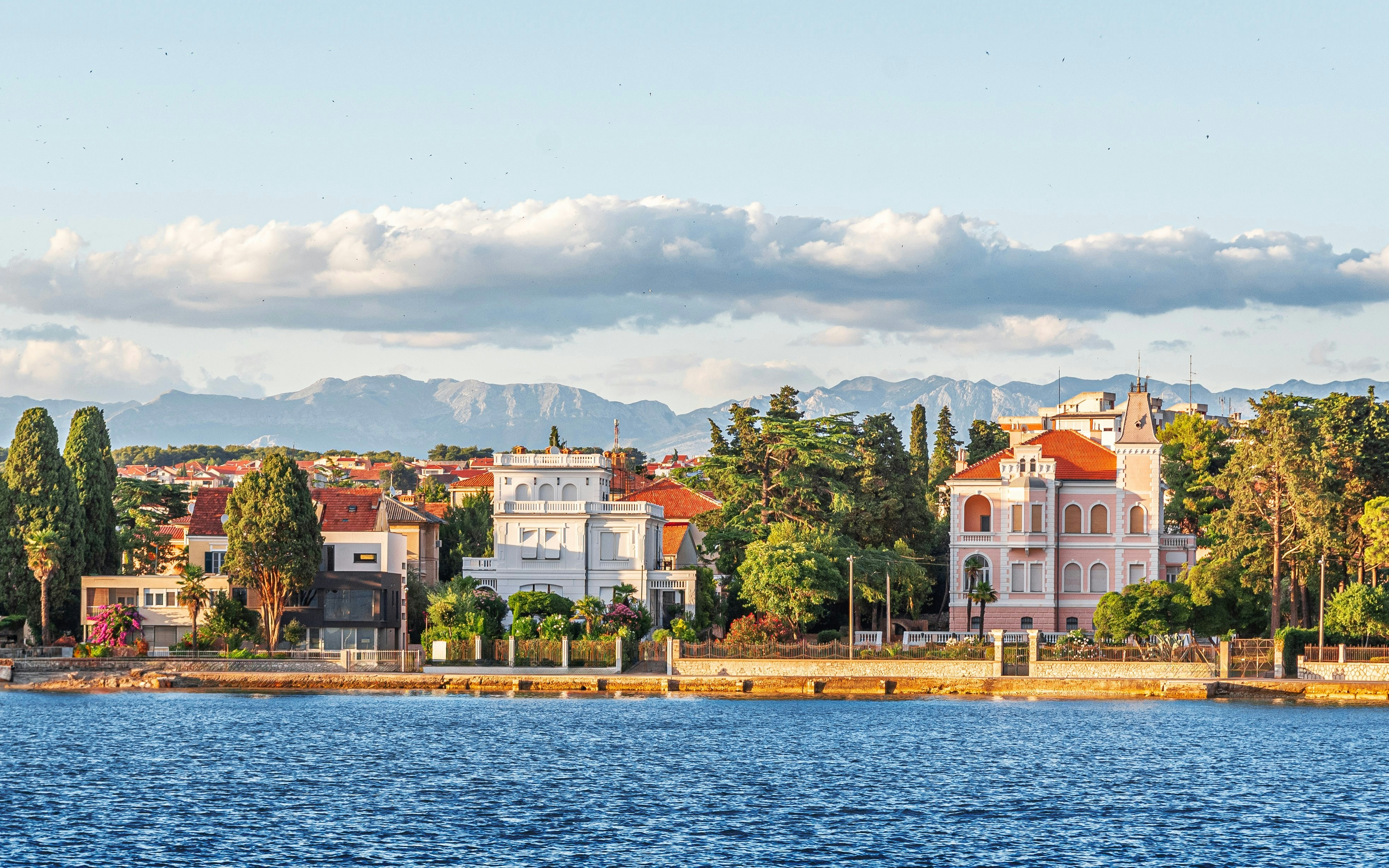 View of Zadar's coastline with historic buildings and mountains, Dalmatia, Croatia.
