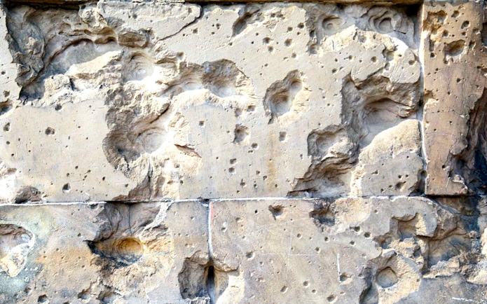 Wall with bullet holes from World War II, Berlin Third Reich Walking Tour.