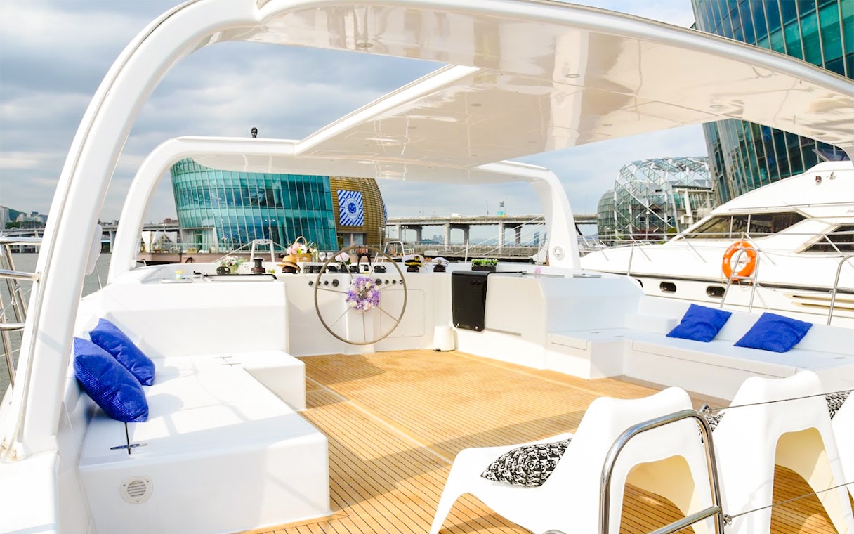 Yacht deck with seating on Han River cruise, Seoul.