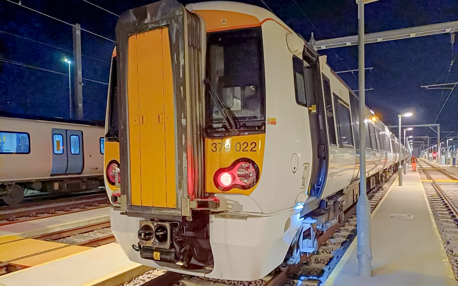 Train at night on platform, London St Pancras International service.
