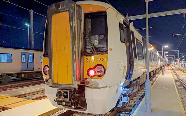 Train at night on platform, London St Pancras International service.