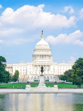 United States Capitol building with reflecting pool and statue in Washington, D.C.