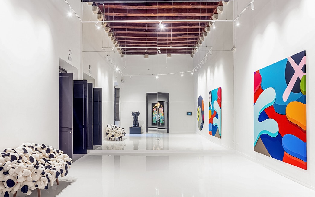 KAWS artwork displayed at Moco Museum in Barcelona gallery.