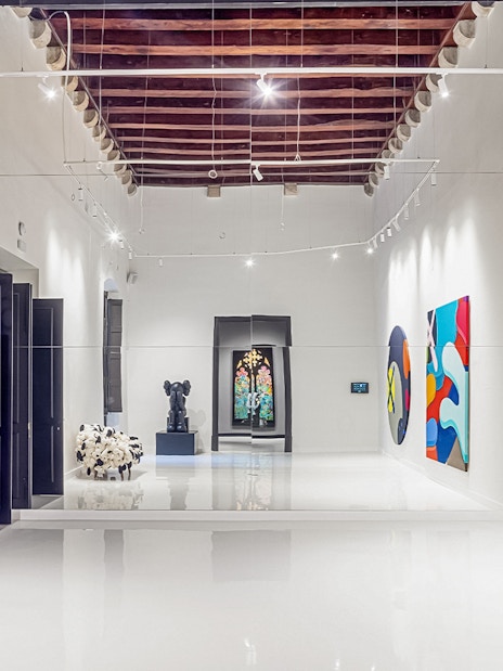 KAWS artwork displayed at Moco Museum in Barcelona gallery.