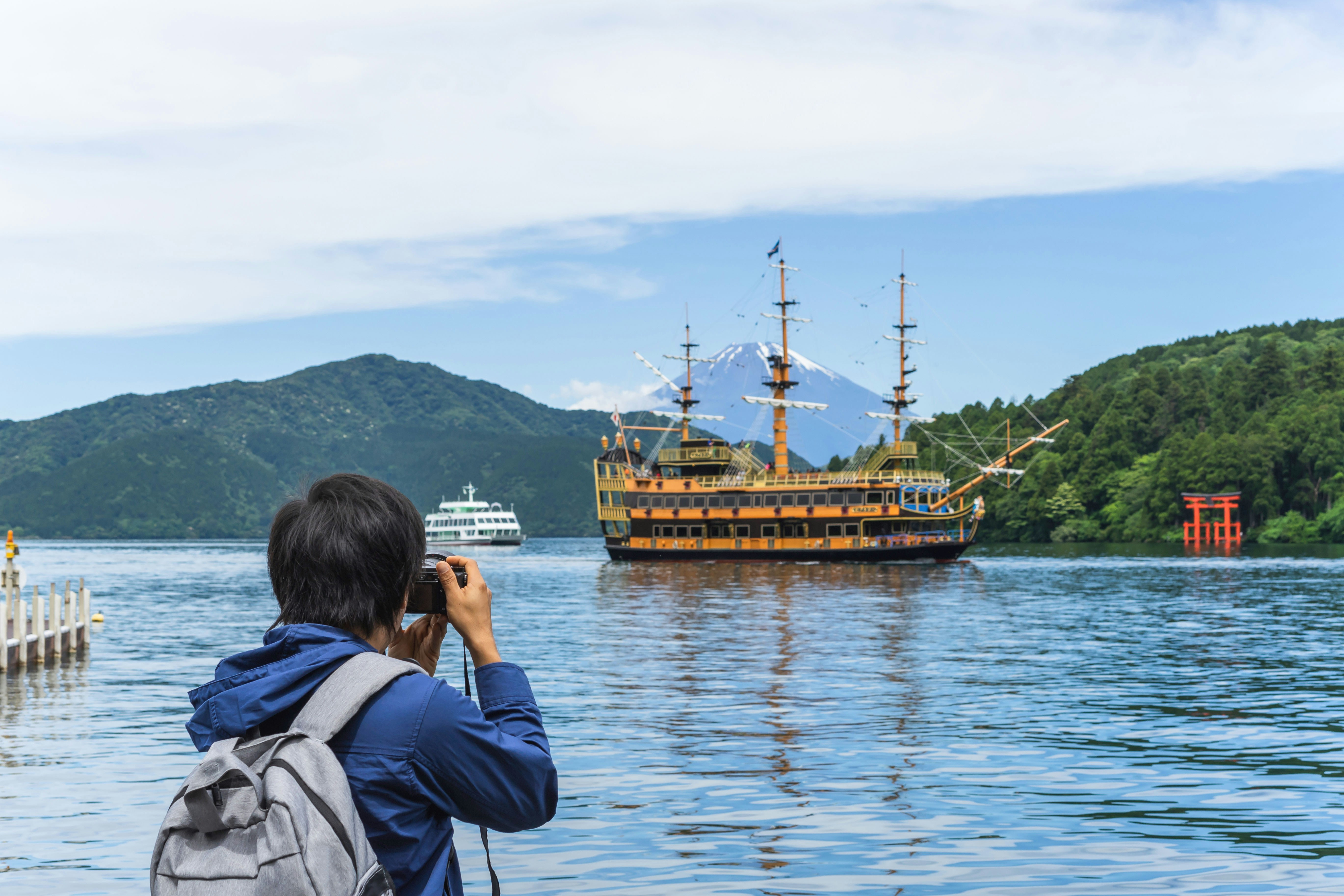Young traveler takeing photo of Hakone shrine