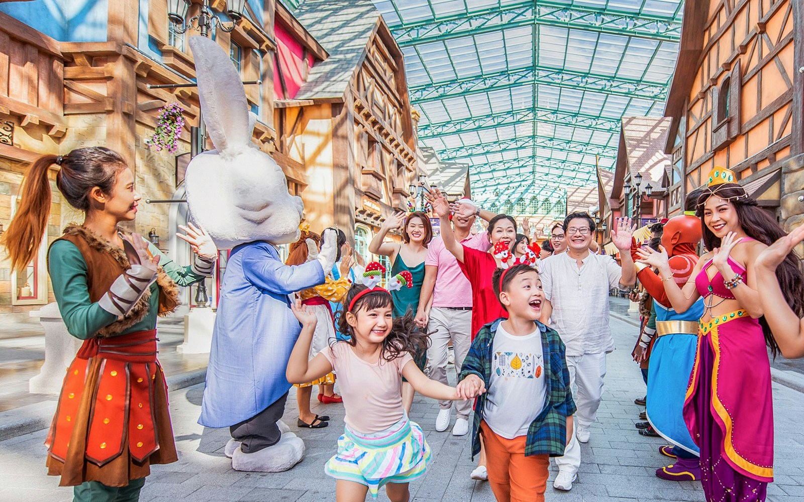 Families enjoying character parades at VinWonders theme park.