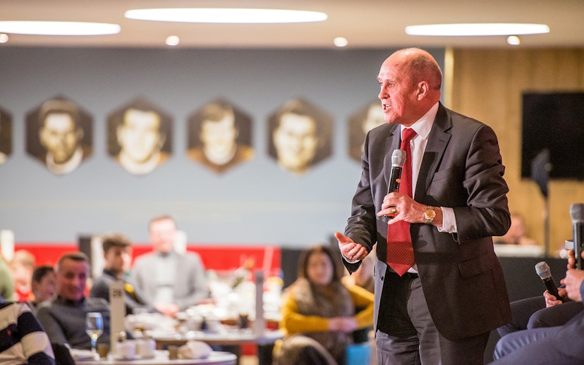 Liverpool FC legend speaking at a Q&A session during a stadium tour.