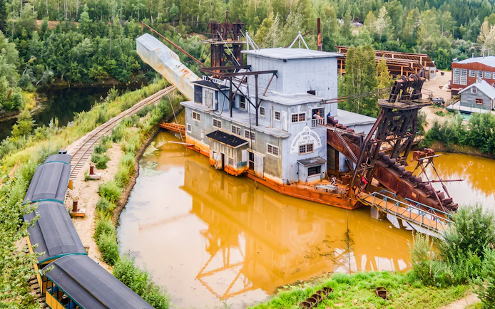 Gold dredge and train tracks on the Ultimate Fairbanks Day Tour in Alaska.