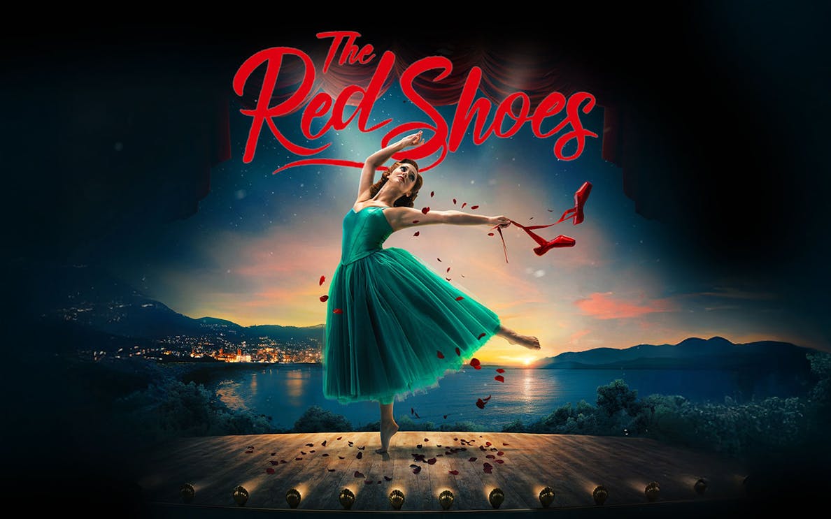 Ballet dancer on stage with red shoes in hand, backdrop of sunset over a lake, "The Red Shoes" text above.