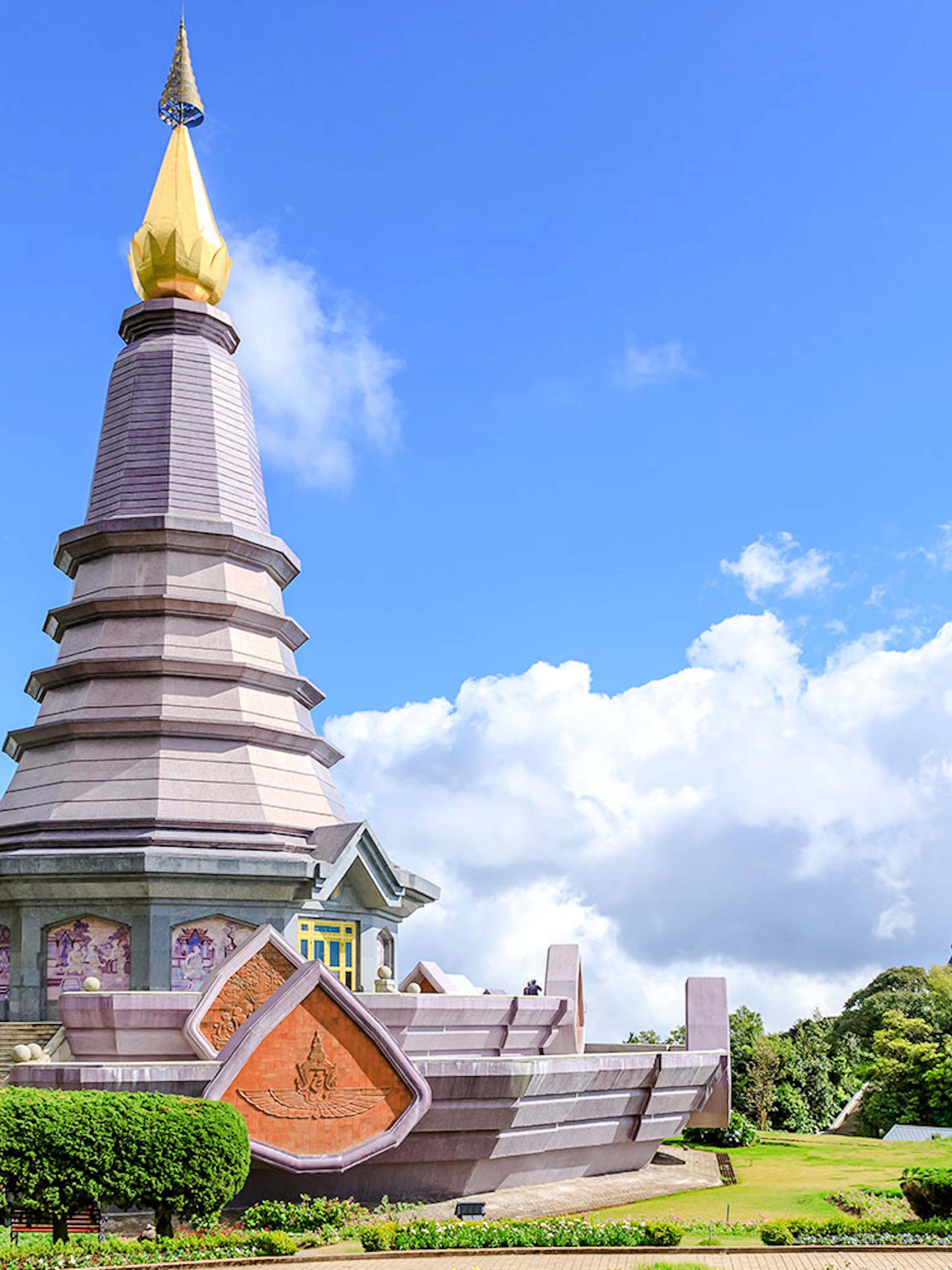 Twin pagodas at Doi Inthanon National Park, Chiang Mai, under a clear blue sky.