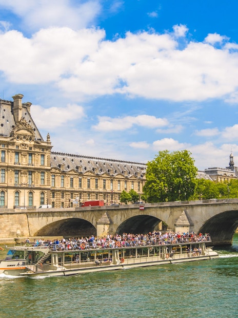 Seine River cruise passing Musée d'Orsay and Pont Royal in Paris.