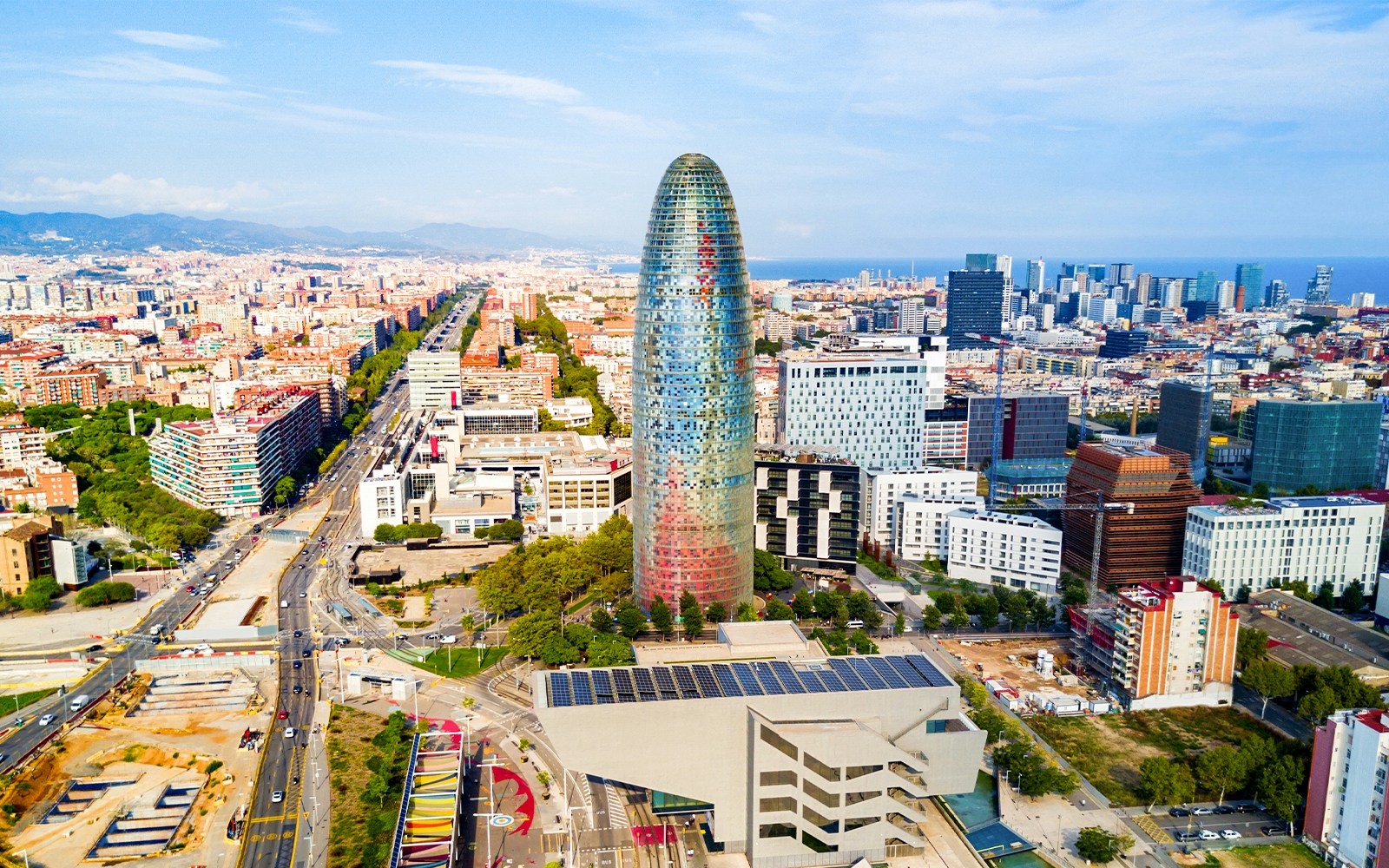 Aerial view of Torre Glòries and cityscape in Barcelona, Spain.