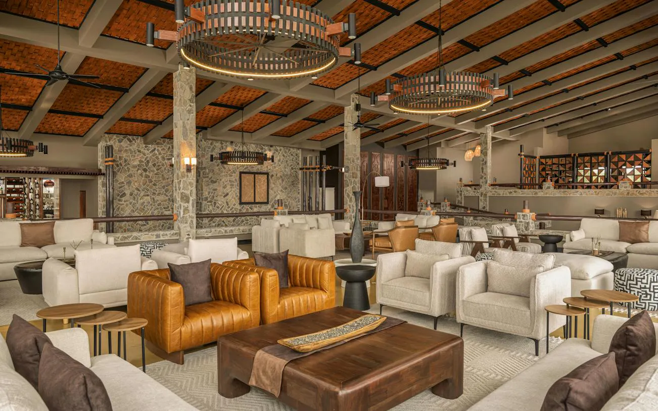Luxurious lounge area in Mikumi National Park lodge, featuring modern seating and decor, Zanzibar.