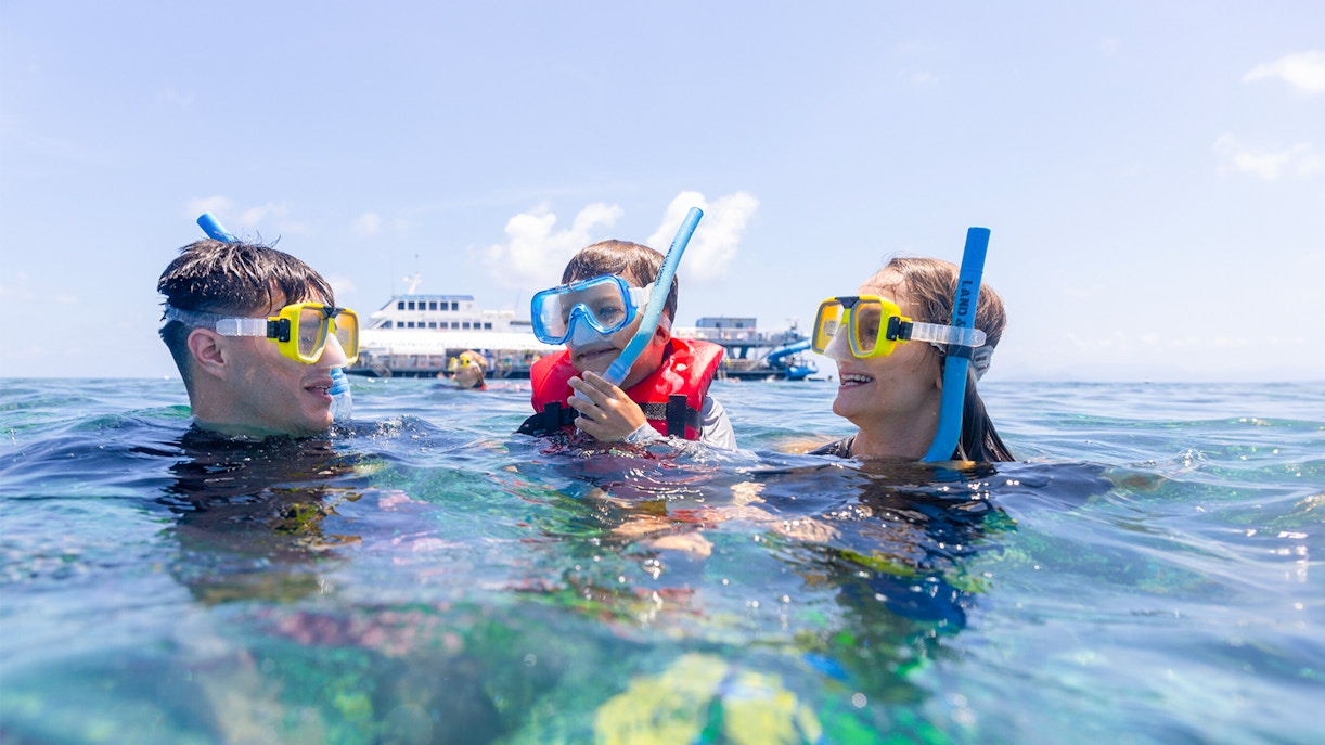 Family snorkeling at Moore Reef with Sunlover Cruises, Great Barrier Reef.