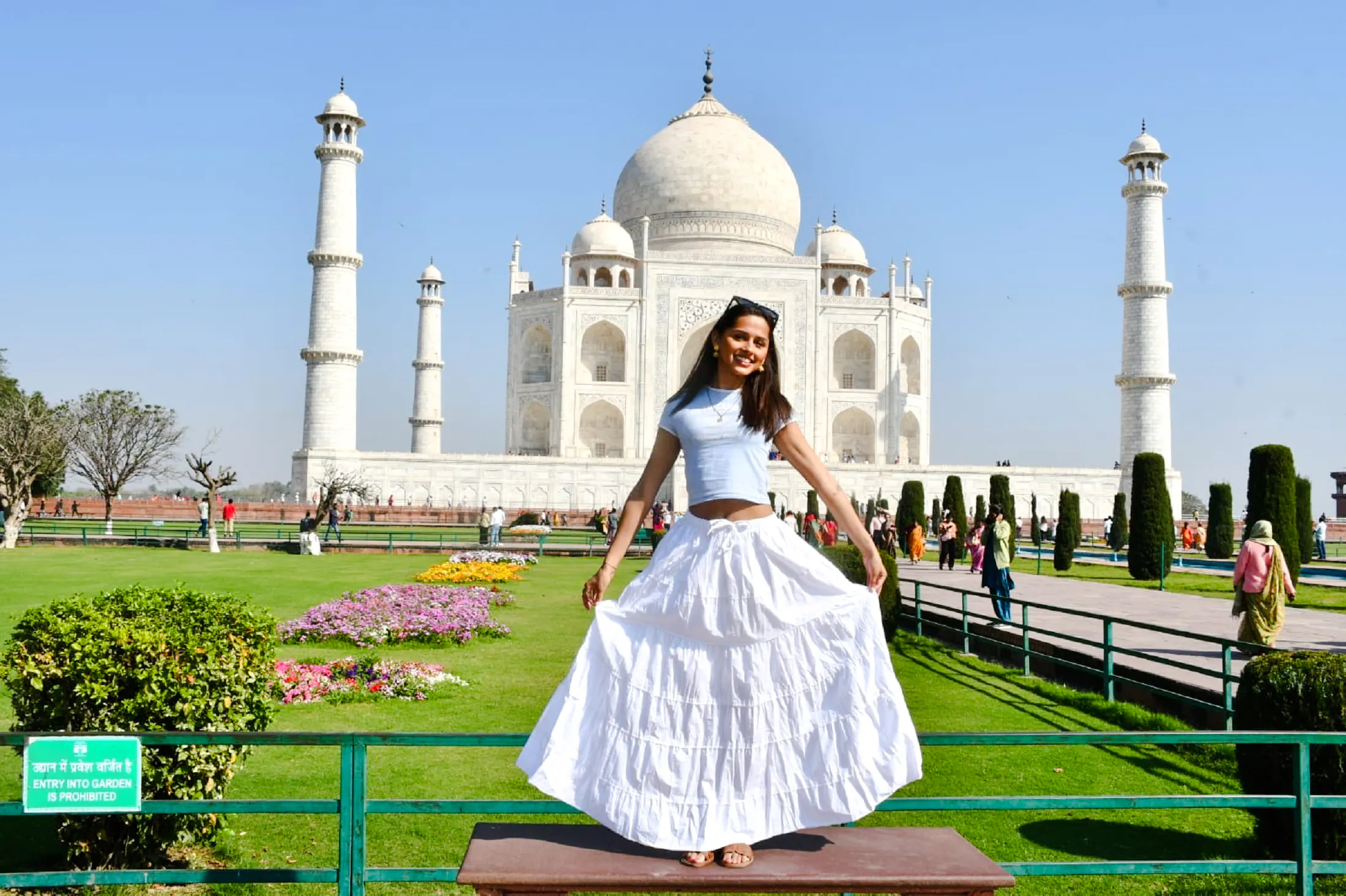 Visitor enjoying the view of the Taj Mahal gardens, Agra.