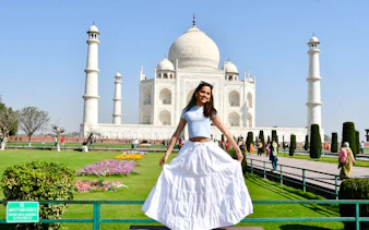 Visitor enjoying the view of the Taj Mahal gardens, Agra.