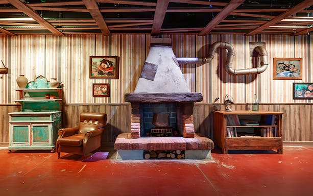 Luna Farm Amusement Park cozy room with vintage decor and fireplace.